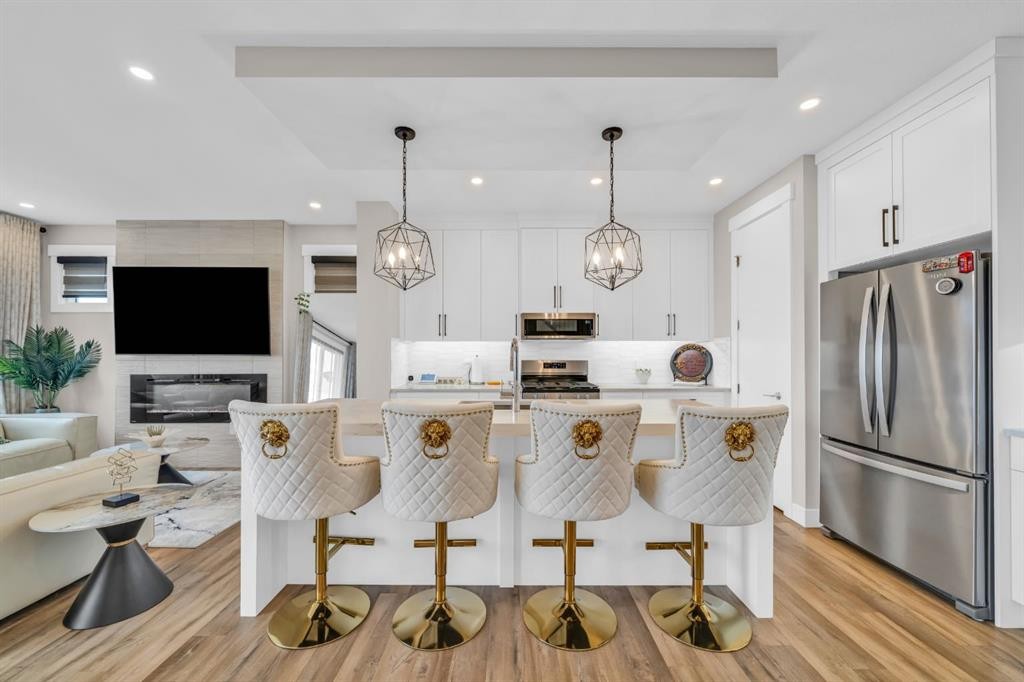 163 Sandpiper Bend, Chestermere, AB - Indoor Photo Showing Other Room With Fireplace