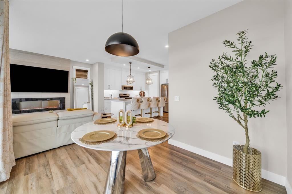 163 Sandpiper Bend, Chestermere, AB - Indoor Photo Showing Other Room With Fireplace