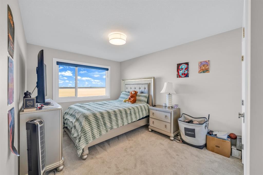 163 Sandpiper Bend, Chestermere, AB - Indoor Photo Showing Bedroom