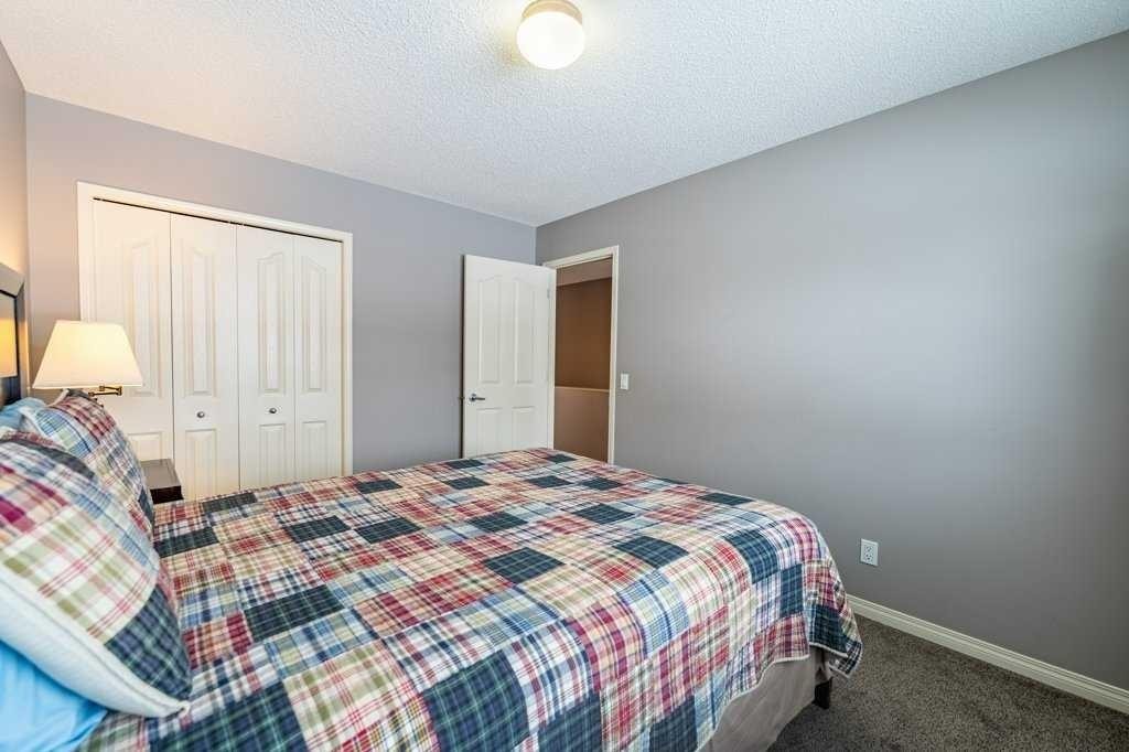 62 Springbluff Boulevard Sw, Calgary, AB - Indoor Photo Showing Bedroom