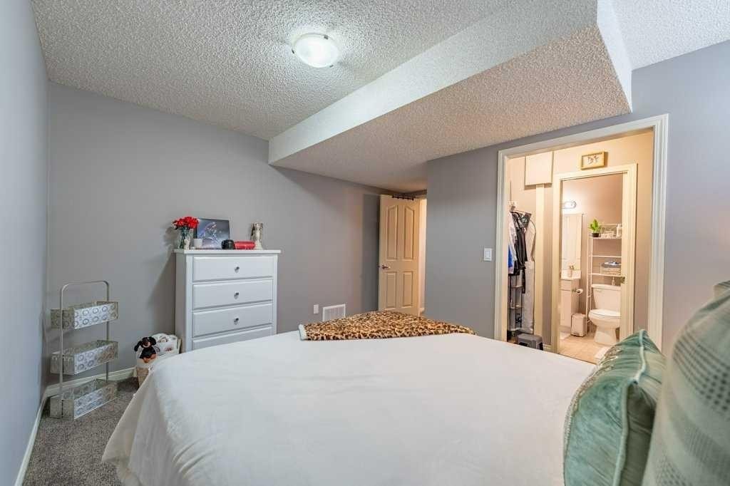62 Springbluff Boulevard Sw, Calgary, AB - Indoor Photo Showing Bedroom