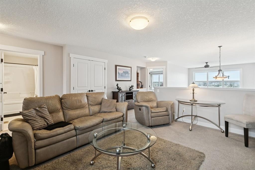 248 Copperpond Circle Se, Calgary, AB - Indoor Photo Showing Living Room