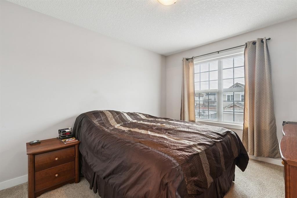 248 Copperpond Circle Se, Calgary, AB - Indoor Photo Showing Bedroom