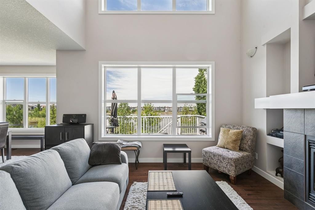 248 Copperpond Circle Se, Calgary, AB - Indoor Photo Showing Living Room With Fireplace