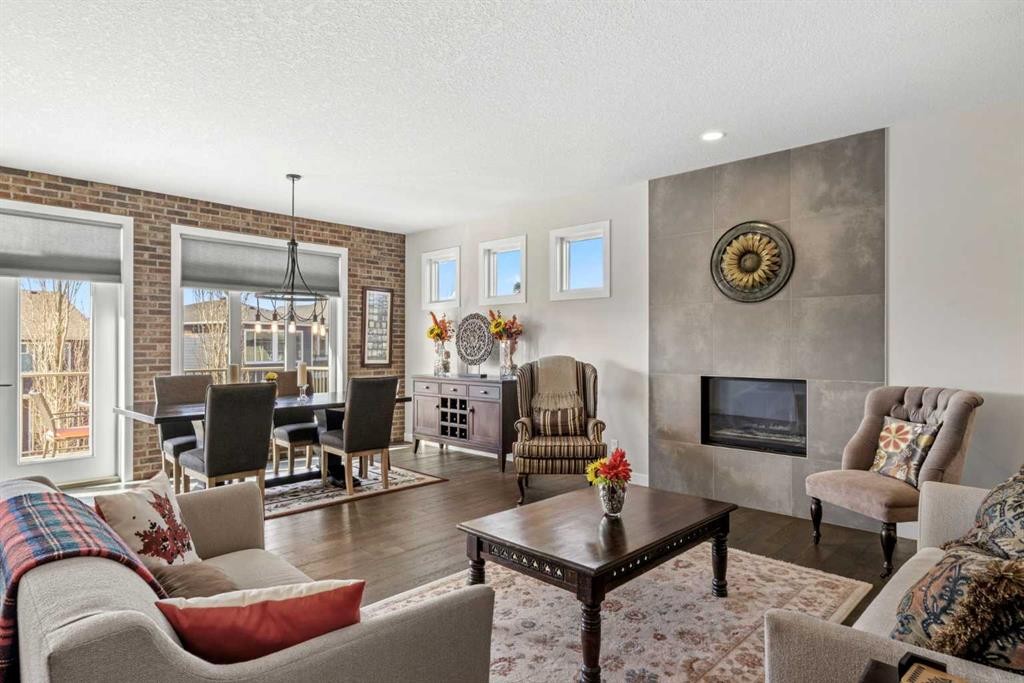 82 Cranbrook Crescent Se, Calgary, AB - Indoor Photo Showing Living Room With Fireplace