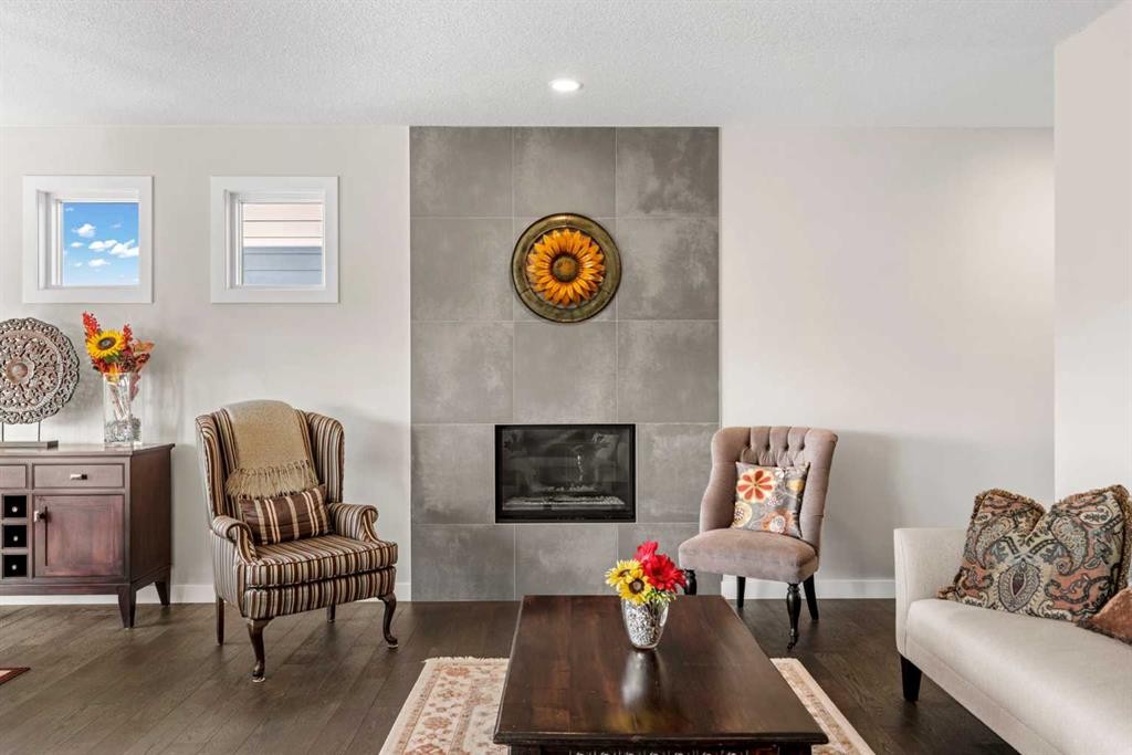 82 Cranbrook Crescent Se, Calgary, AB - Indoor Photo Showing Living Room With Fireplace