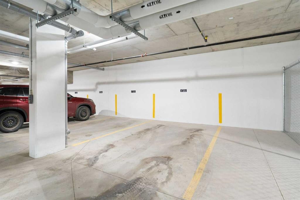 402-1505 Spring Creek Gate, Canmore, AB - Indoor Photo Showing Garage