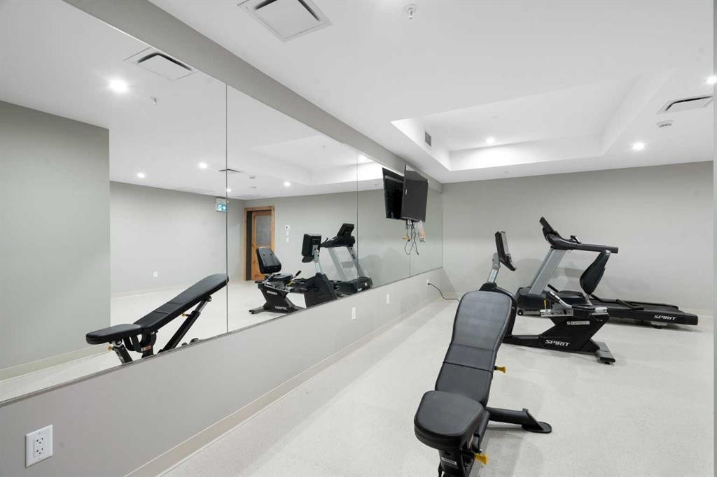 402-1505 Spring Creek Gate, Canmore, AB - Indoor Photo Showing Gym Room