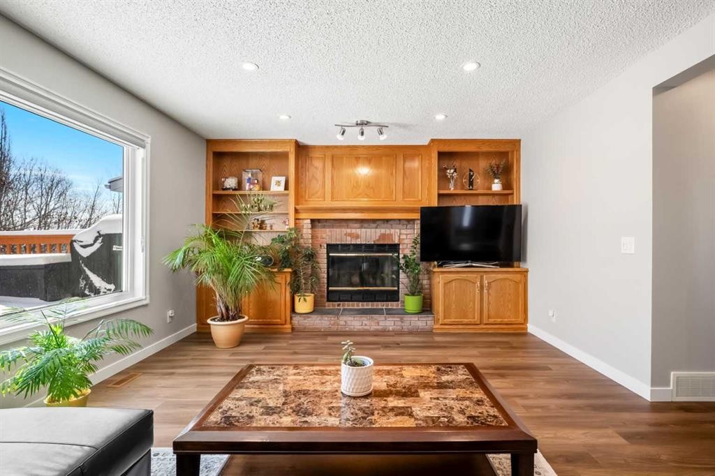 412 Hawkland Place Nw, Calgary, AB - Indoor Photo Showing Living Room With Fireplace