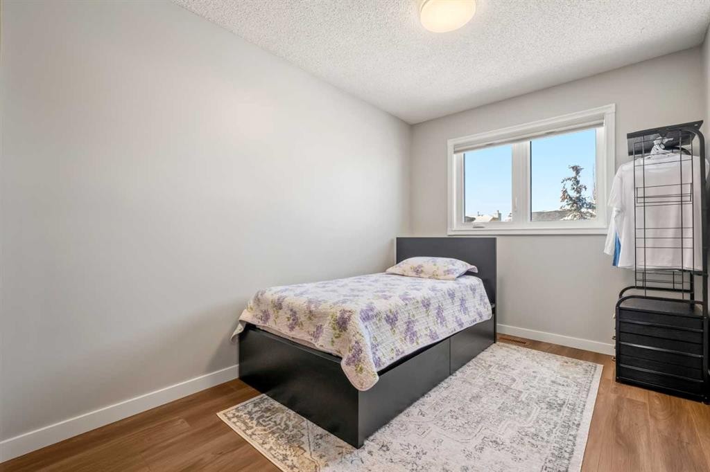 412 Hawkland Place Nw, Calgary, AB - Indoor Photo Showing Bedroom