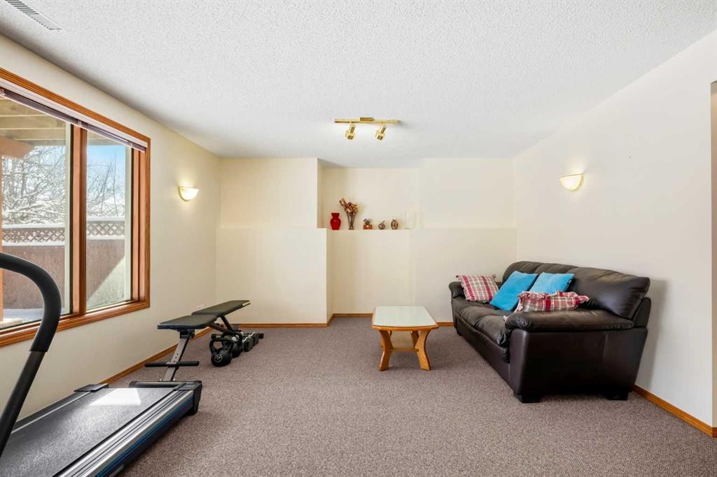 412 Hawkland Place Nw, Calgary, AB - Indoor Photo Showing Gym Room