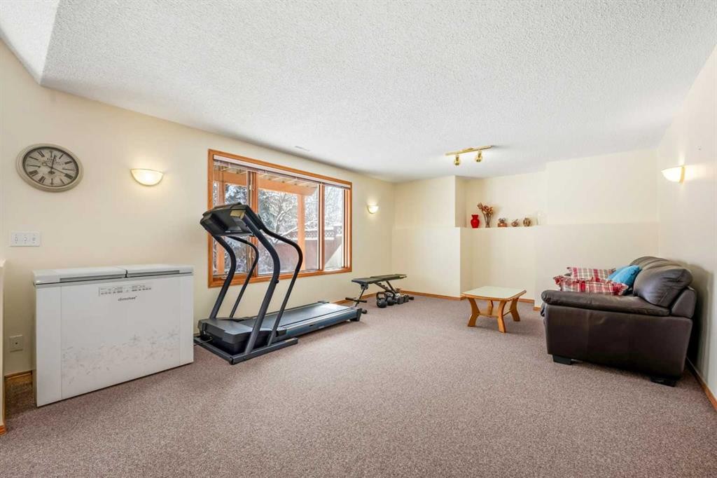 412 Hawkland Place Nw, Calgary, AB - Indoor Photo Showing Gym Room
