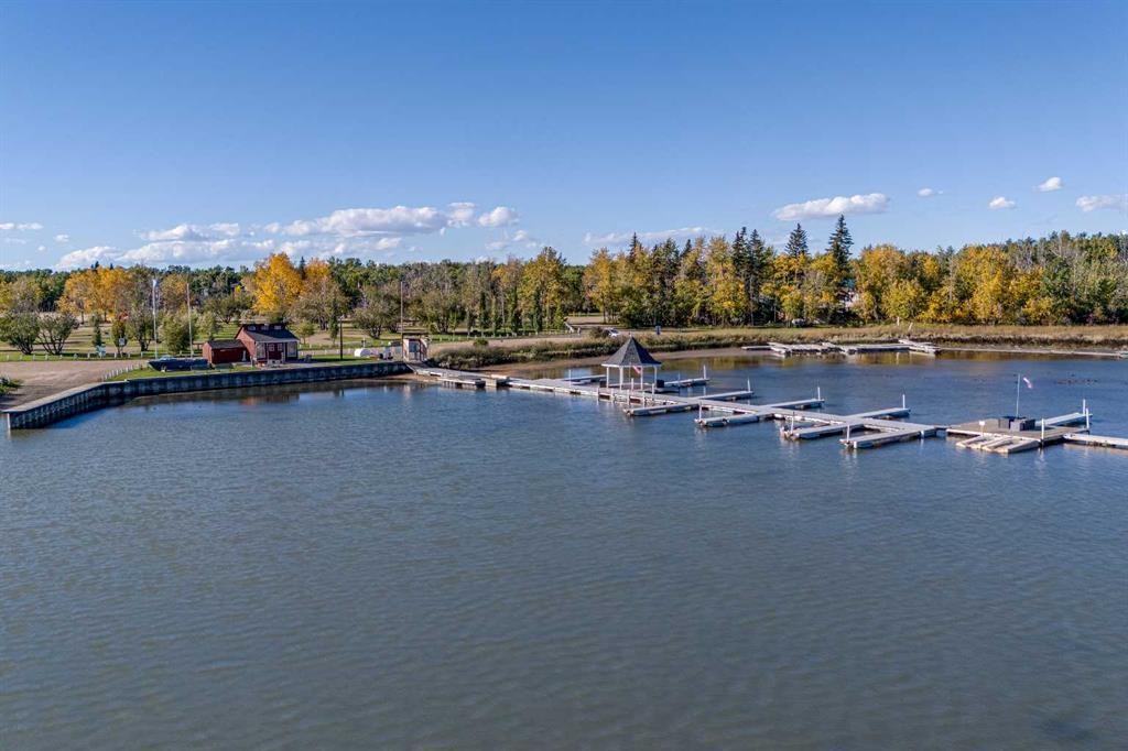 602 Pheasant Close, Pelican Point, AB - Outdoor With Body Of Water With View