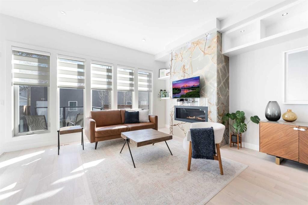 231 12 Avenue Ne, Calgary, AB - Indoor Photo Showing Other Room With Fireplace