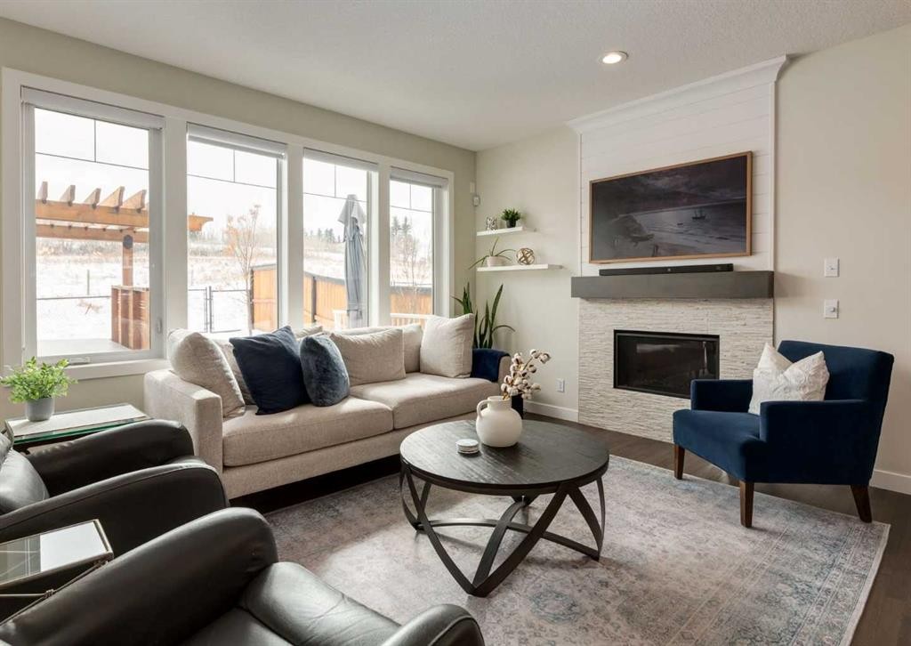 60 Crestbrook View Sw, Calgary, AB - Indoor Photo Showing Living Room With Fireplace