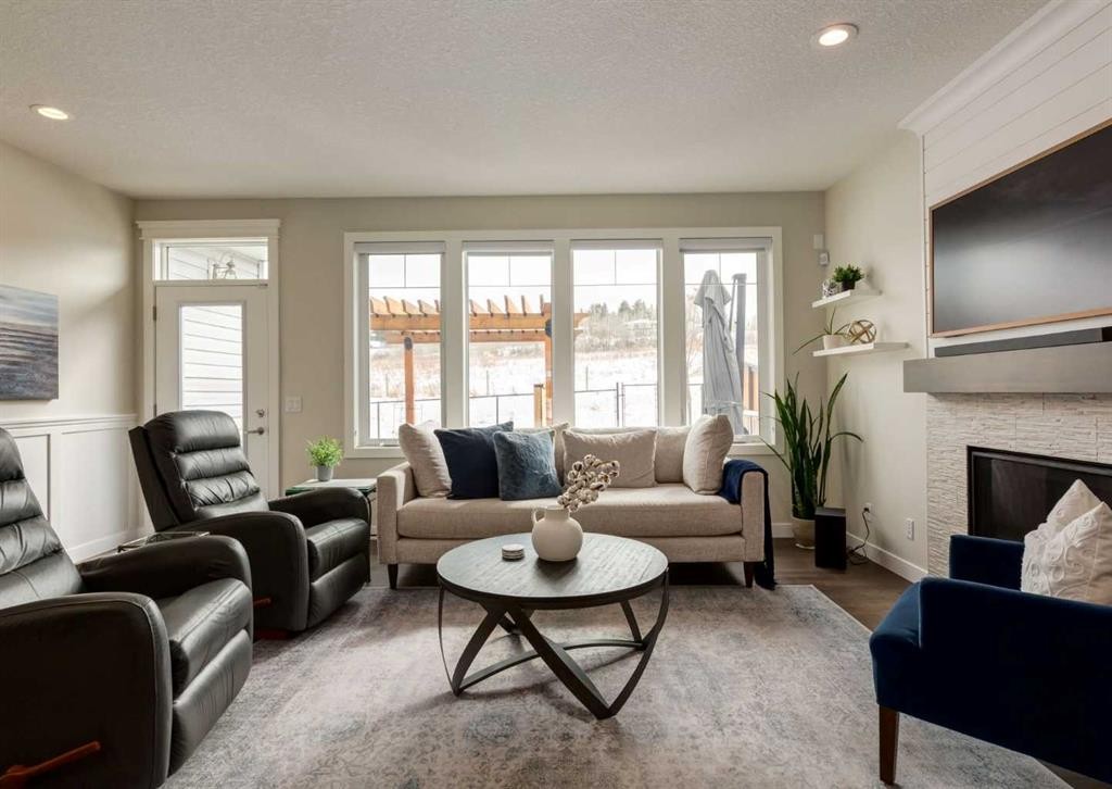 60 Crestbrook View Sw, Calgary, AB - Indoor Photo Showing Living Room With Fireplace