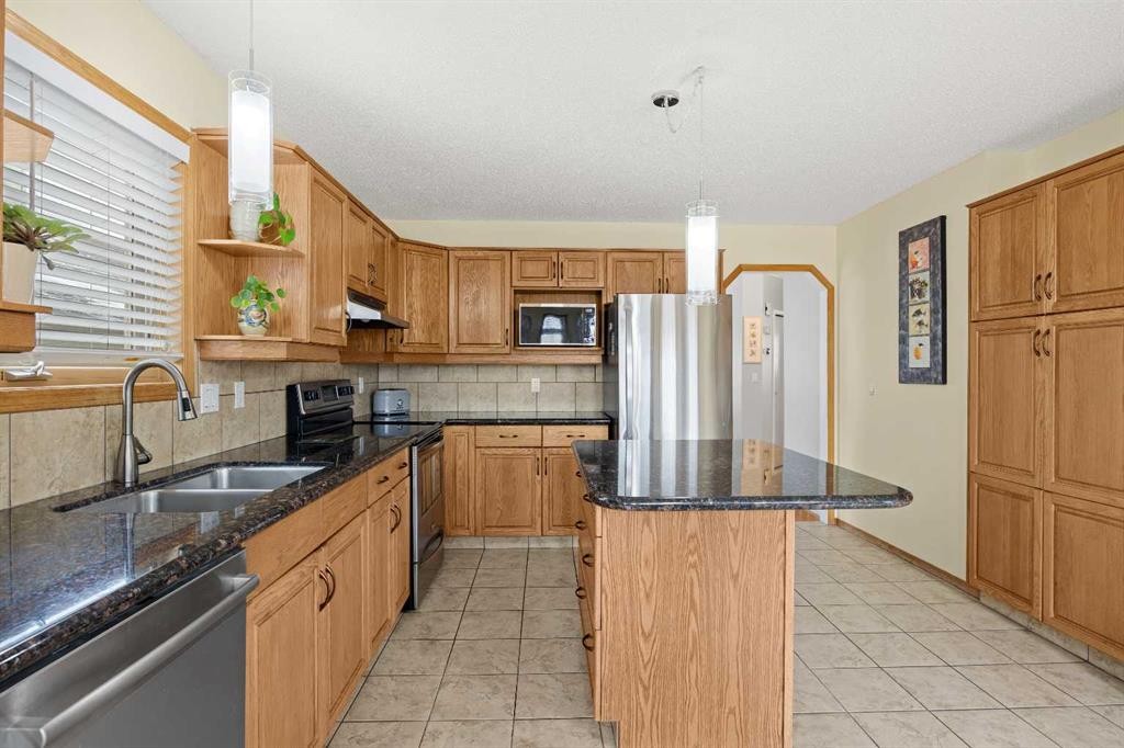 1331 Sunvista Way Se, Calgary, AB - Indoor Photo Showing Kitchen With Double Sink