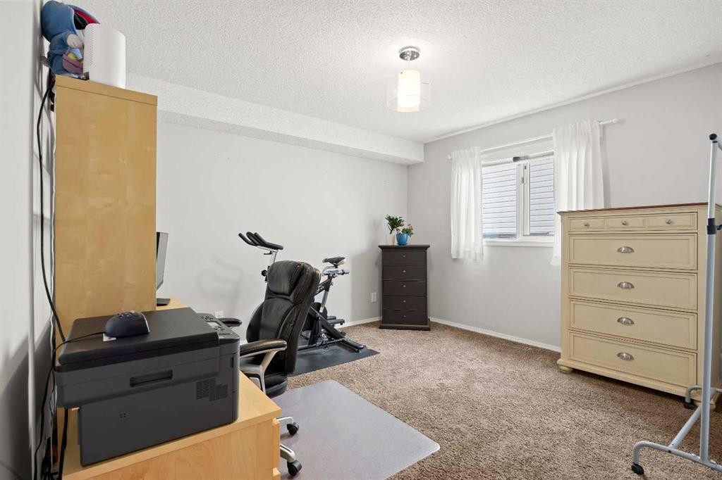 1331 Sunvista Way Se, Calgary, AB - Indoor Photo Showing Gym Room