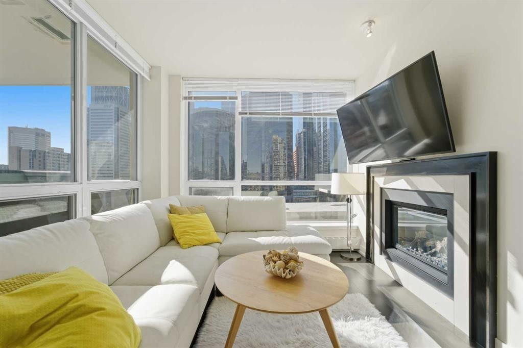 825-222 Riverfront Avenue Sw, Calgary, AB - Indoor Photo Showing Living Room With Fireplace