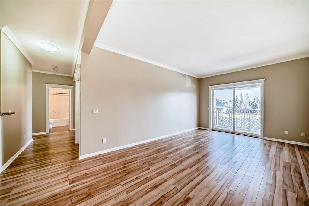 205-7 Lineham Avenue, Okotoks, AB - Indoor Photo Showing Other Room