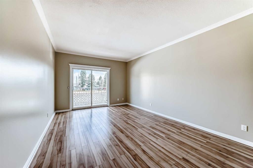 205-7 Lineham Avenue, Okotoks, AB - Indoor Photo Showing Other Room