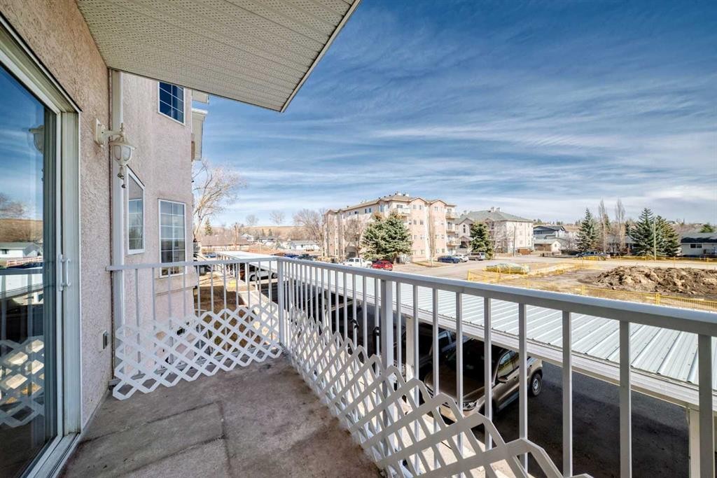 205-7 Lineham Avenue, Okotoks, AB - Outdoor With Balcony With Exterior