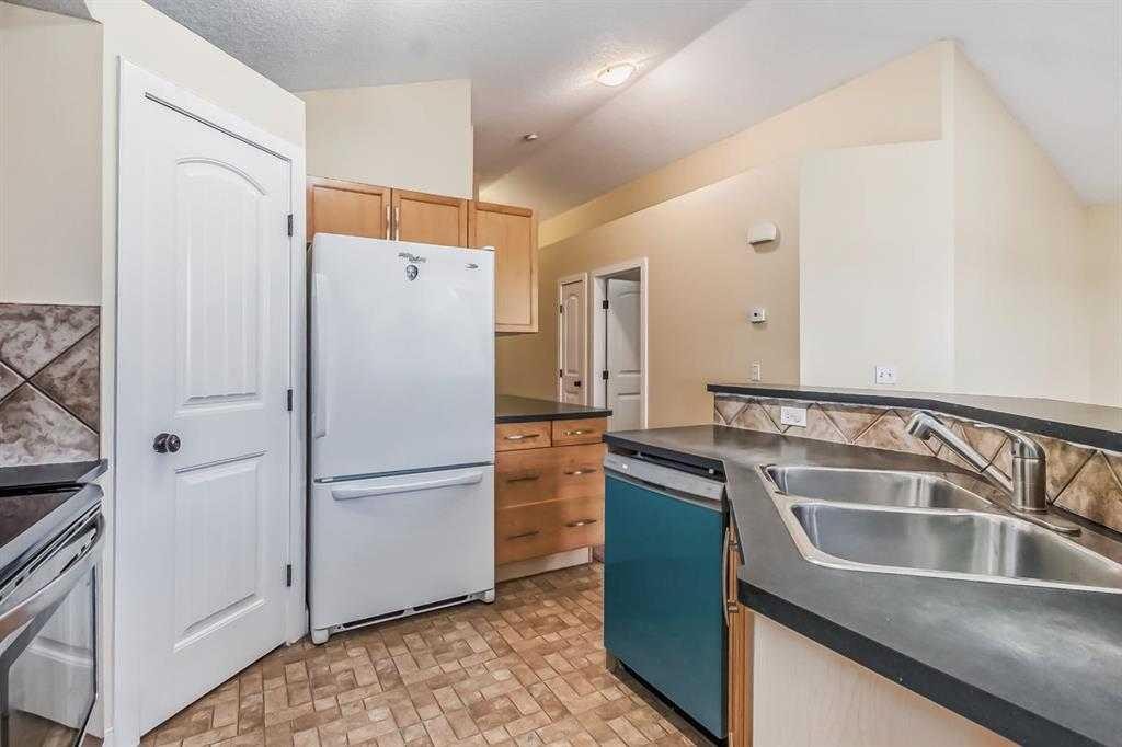 211 Saddlebrook Way Ne, Calgary, AB - Indoor Photo Showing Kitchen With Double Sink