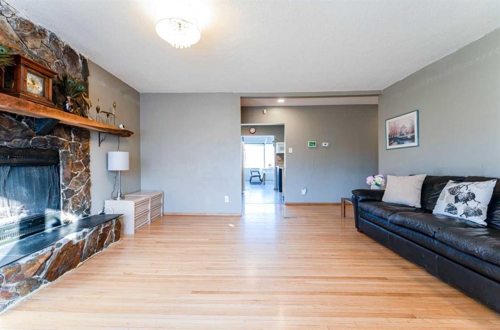 2018 Cottonwood Crescent Se, Calgary, AB - Indoor Photo Showing Living Room With Fireplace
