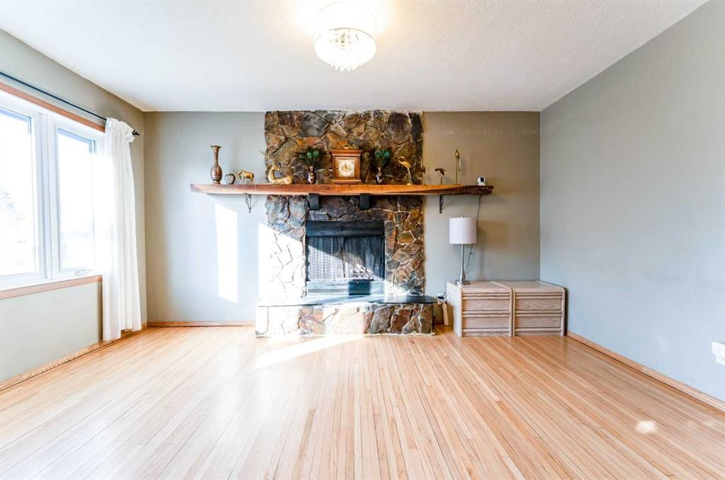 2018 Cottonwood Crescent Se, Calgary, AB - Indoor Photo Showing Other Room With Fireplace