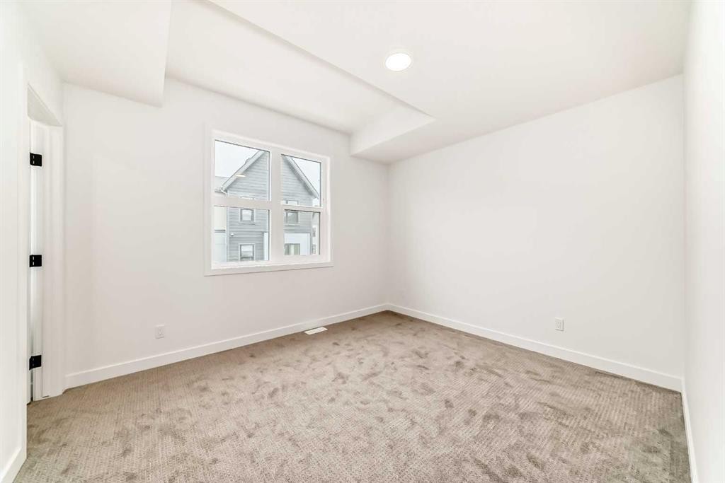 86 Heirloom Passage Se, Calgary, AB - Indoor Photo Showing Other Room