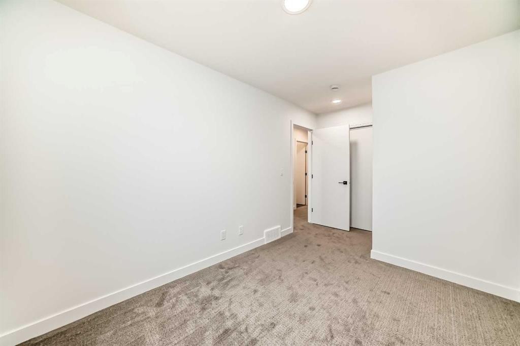 86 Heirloom Passage Se, Calgary, AB - Indoor Photo Showing Other Room