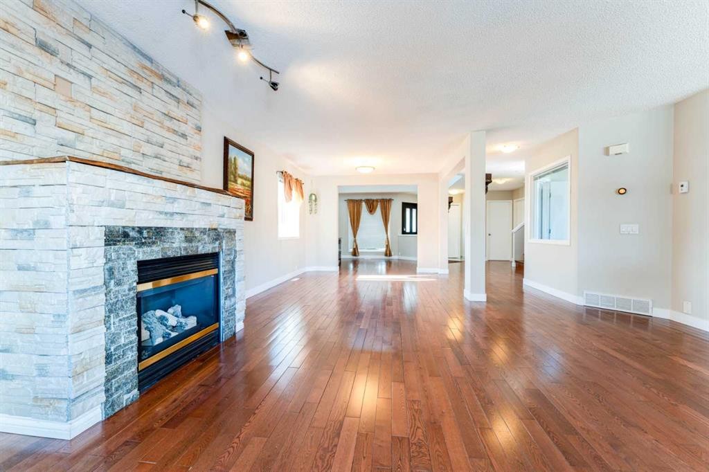 343 Millview Bay Sw, Calgary, AB - Indoor Photo Showing Other Room With Fireplace