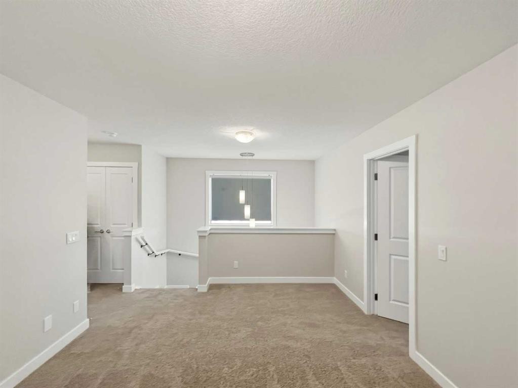125 Edith Gate Nw, Calgary, AB - Indoor Photo Showing Other Room