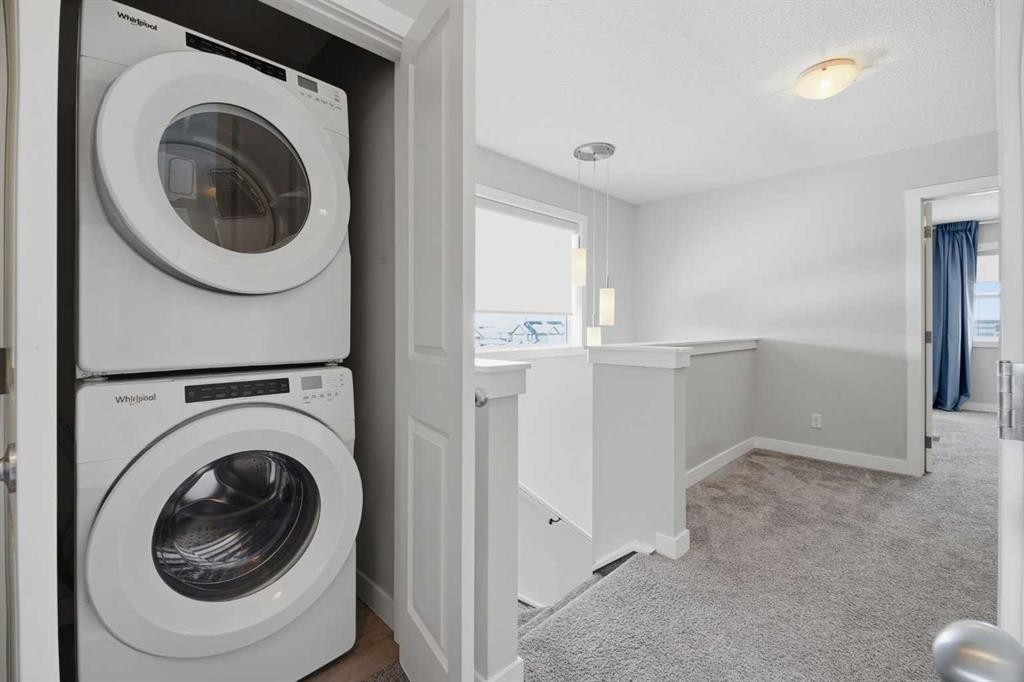 125 Edith Gate Nw, Calgary, AB - Indoor Photo Showing Laundry Room