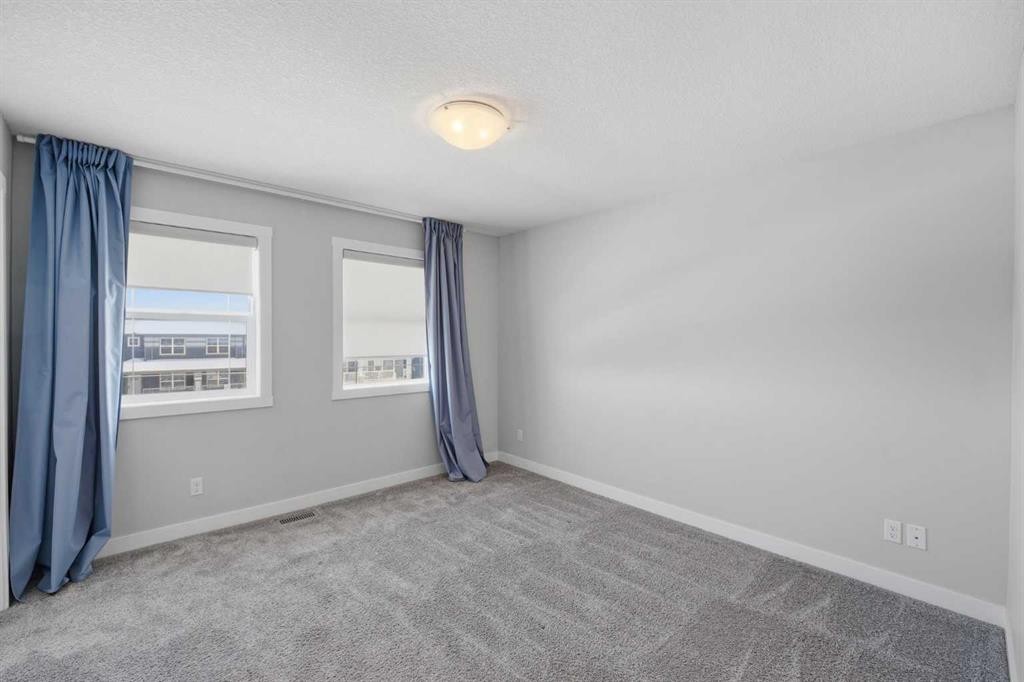 125 Edith Gate Nw, Calgary, AB - Indoor Photo Showing Other Room