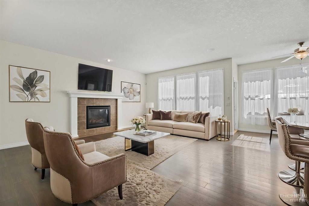 386 Mahogany Terrace Se, Calgary, AB - Indoor Photo Showing Living Room With Fireplace