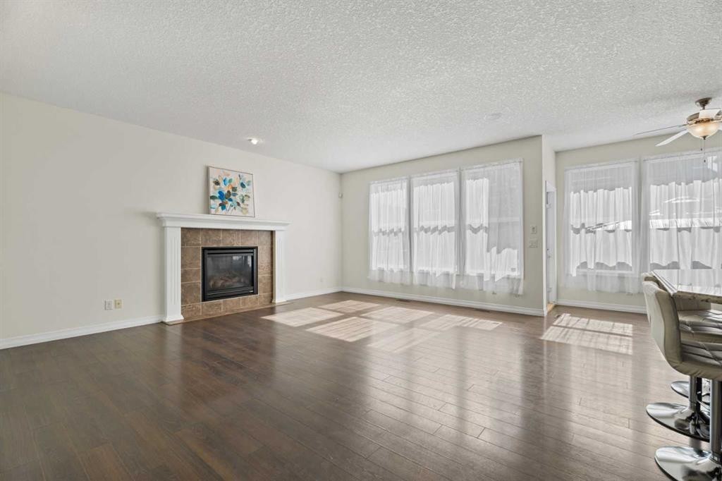 386 Mahogany Terrace Se, Calgary, AB - Indoor Photo Showing Living Room With Fireplace