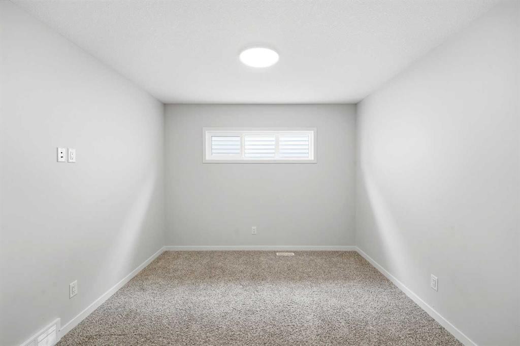 34 Aquila Way Nw, Calgary, AB - Indoor Photo Showing Other Room