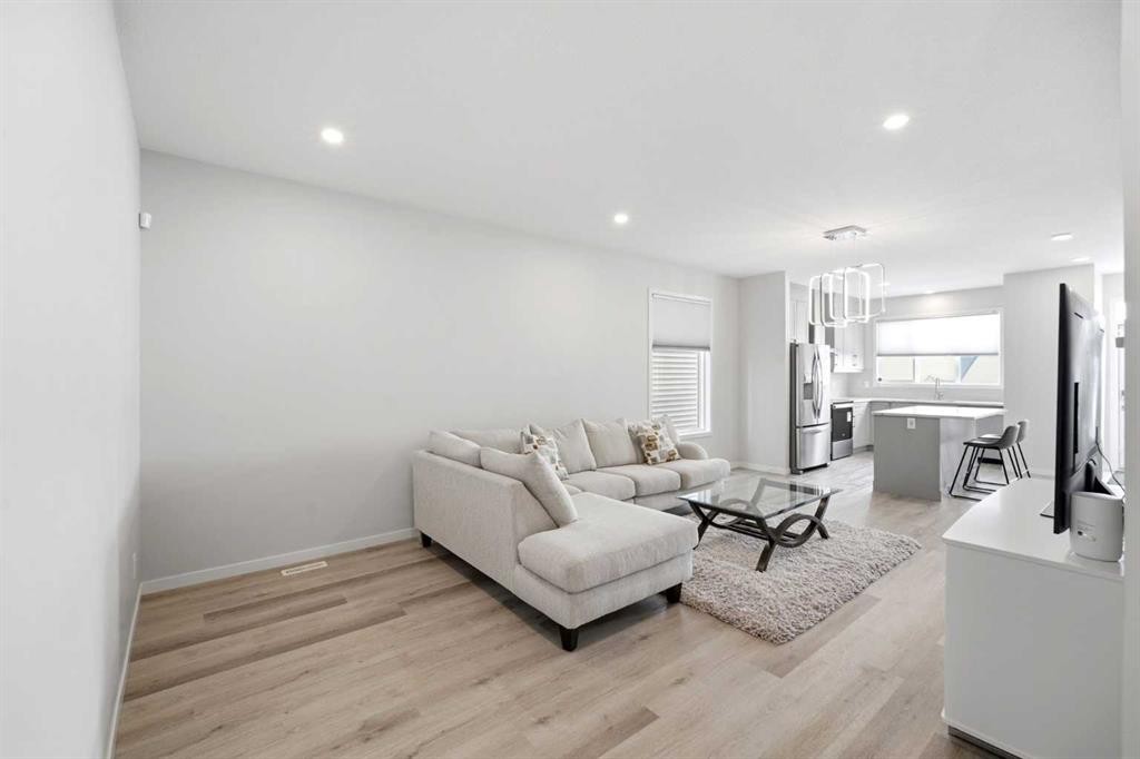 34 Aquila Way Nw, Calgary, AB - Indoor Photo Showing Living Room