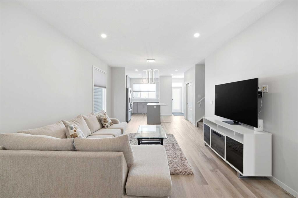 34 Aquila Way Nw, Calgary, AB - Indoor Photo Showing Living Room