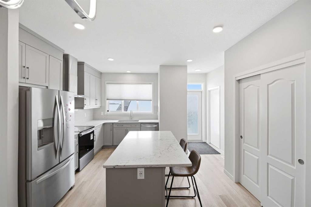 34 Aquila Way Nw, Calgary, AB - Indoor Photo Showing Kitchen With Stainless Steel Kitchen With Upgraded Kitchen