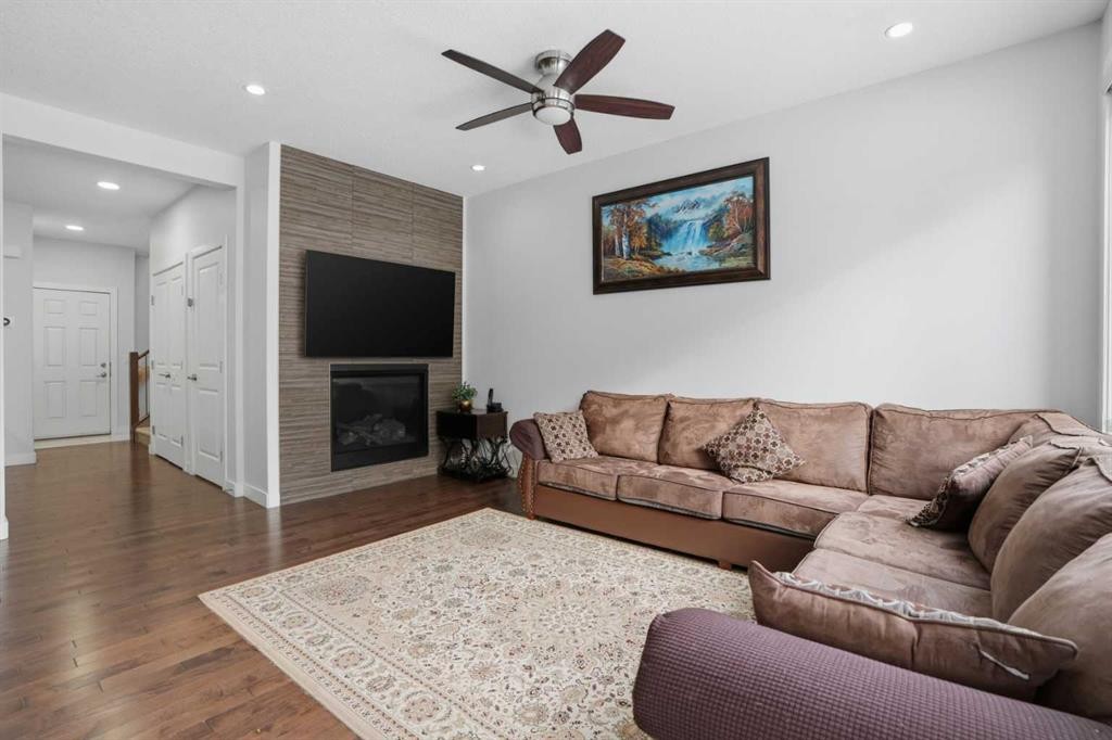 154 Saddlelake Way Ne, Calgary, AB - Indoor Photo Showing Living Room With Fireplace