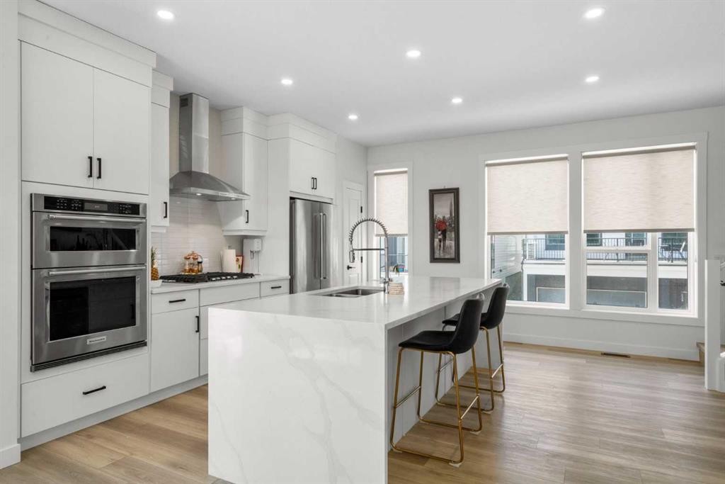 244 Sovereign Common Sw, Calgary, AB - Indoor Photo Showing Kitchen With Double Sink With Upgraded Kitchen