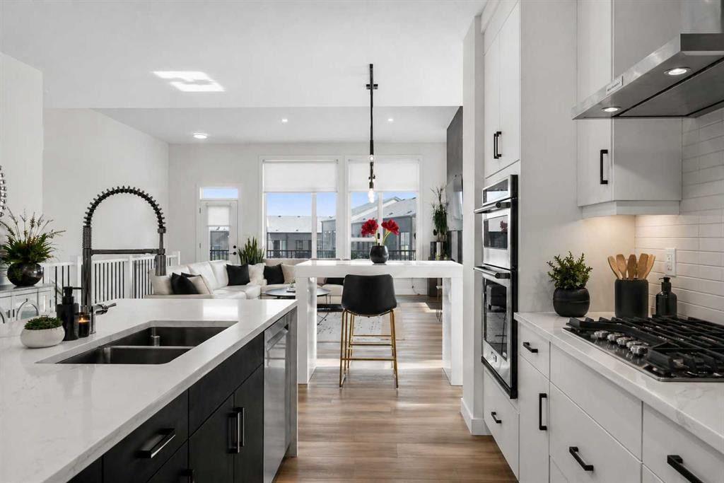 244 Sovereign Common Sw, Calgary, AB - Indoor Photo Showing Kitchen With Double Sink With Upgraded Kitchen