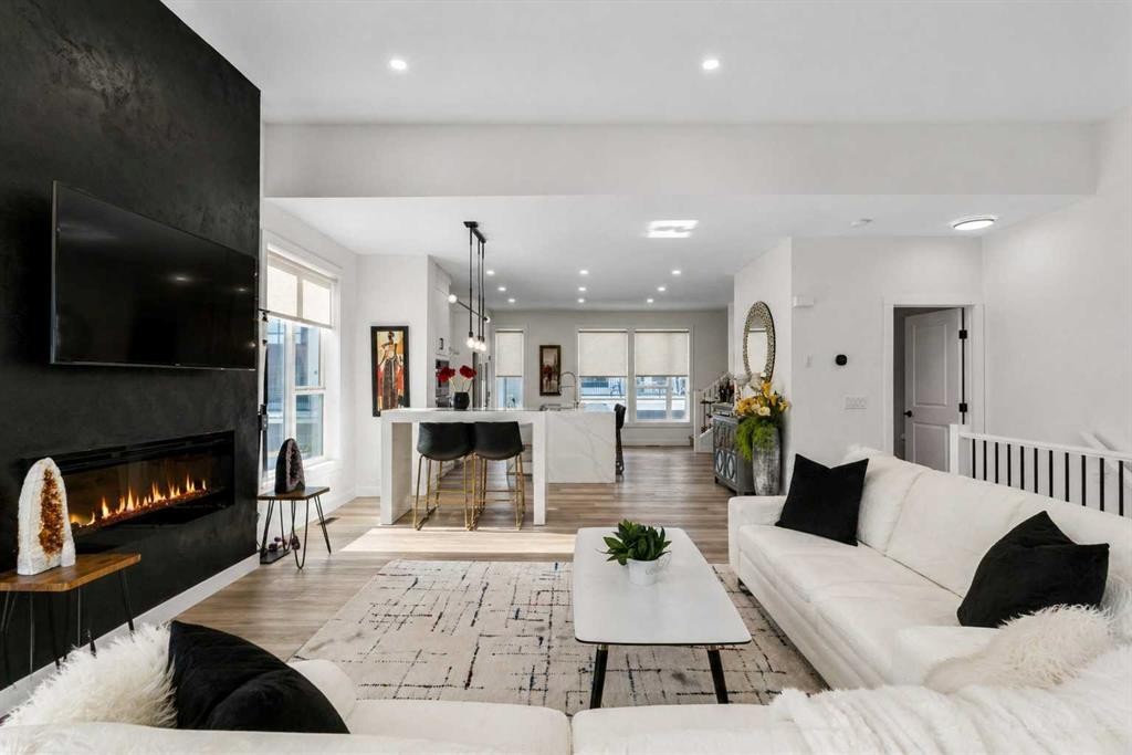 244 Sovereign Common Sw, Calgary, AB - Indoor Photo Showing Living Room With Fireplace