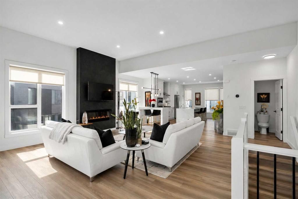 244 Sovereign Common Sw, Calgary, AB - Indoor Photo Showing Living Room With Fireplace