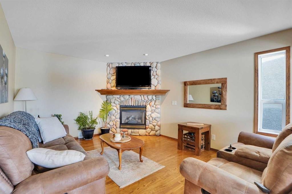 32 Harvest Park Way Ne, Calgary, AB - Indoor Photo Showing Living Room With Fireplace