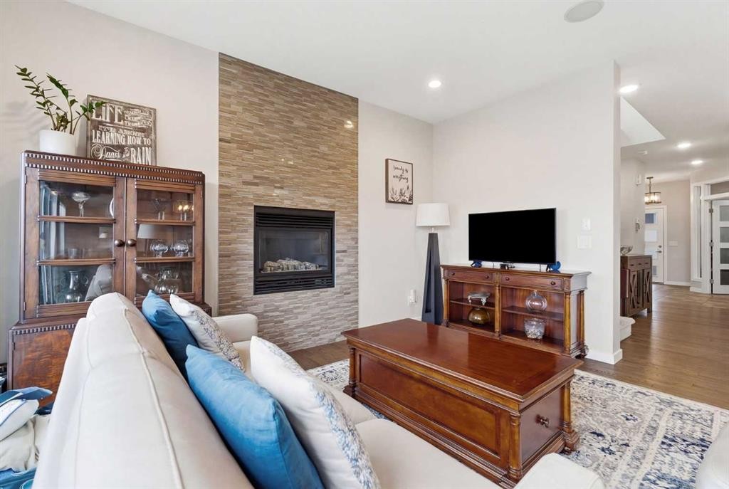 52 Walden Green Se, Calgary, AB - Indoor Photo Showing Living Room With Fireplace