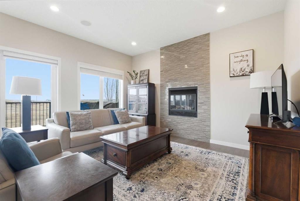 52 Walden Green Se, Calgary, AB - Indoor Photo Showing Living Room With Fireplace