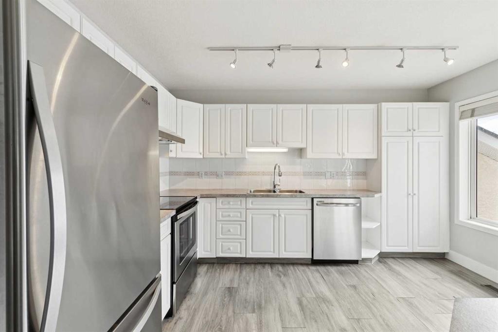 328 Prominence Heights Sw, Calgary, AB - Indoor Photo Showing Kitchen With Double Sink